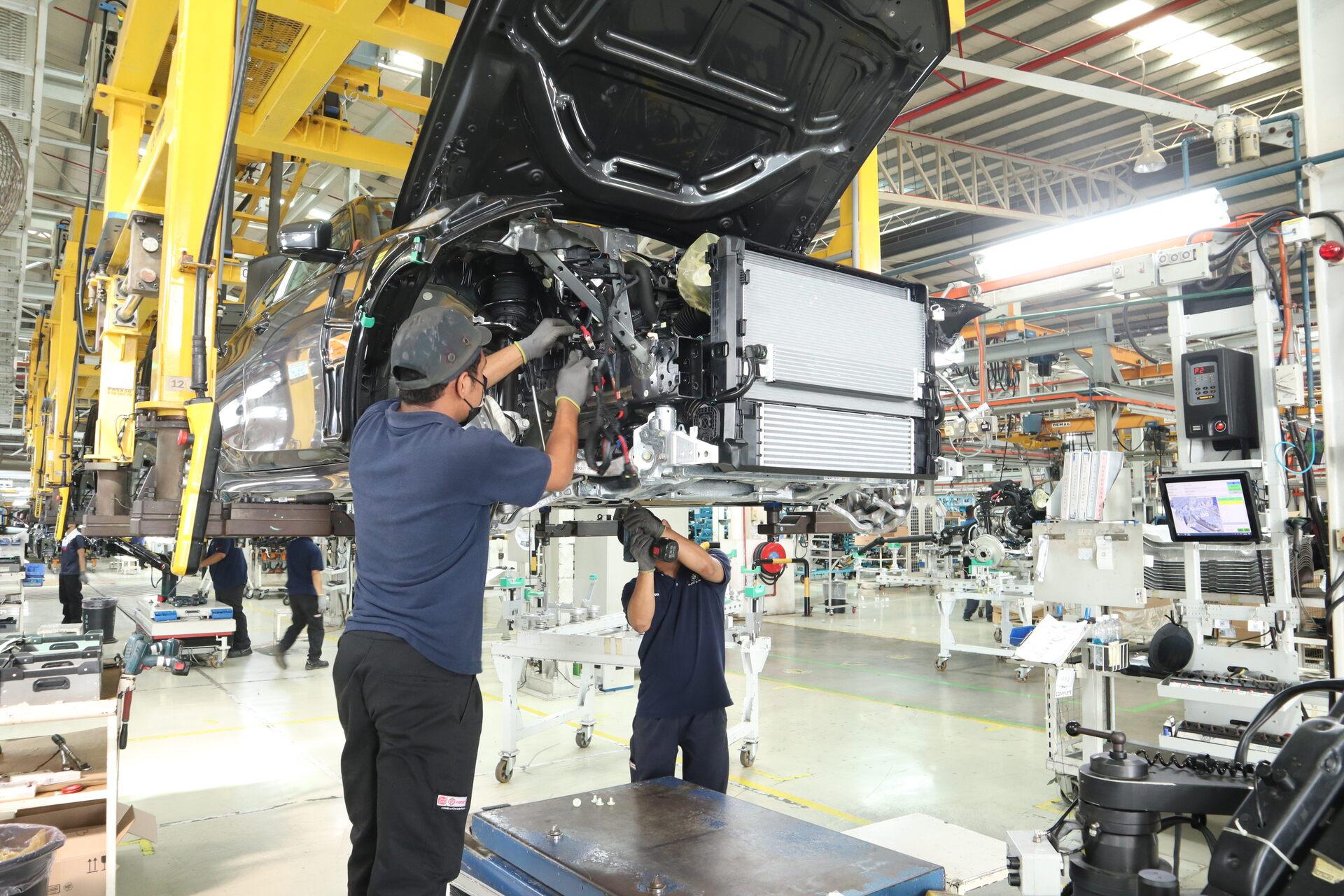 Workers assembling a vehicle at the Inokom plant in Kulim, Kedah
